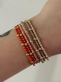 Colorful bracelet stackers in gold
