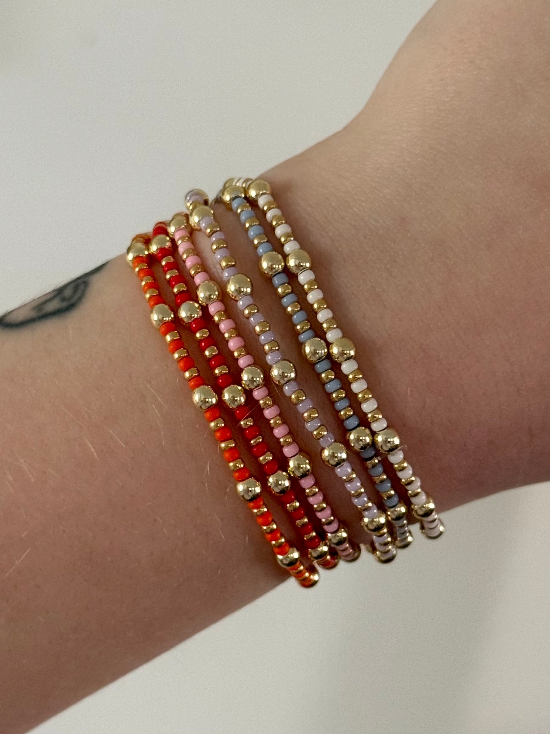 Colorful bracelet stackers in gold