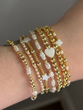 Classic bracelet stack in gold